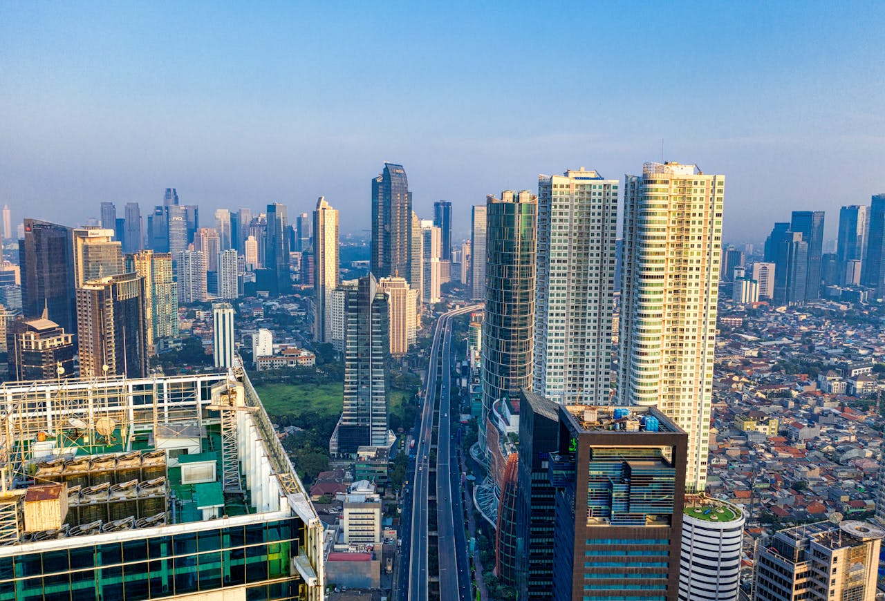 Breathtaking aerial view of South Jakarta's modern skyline featuring towering skyscrapers and cityscape under a clear sky.