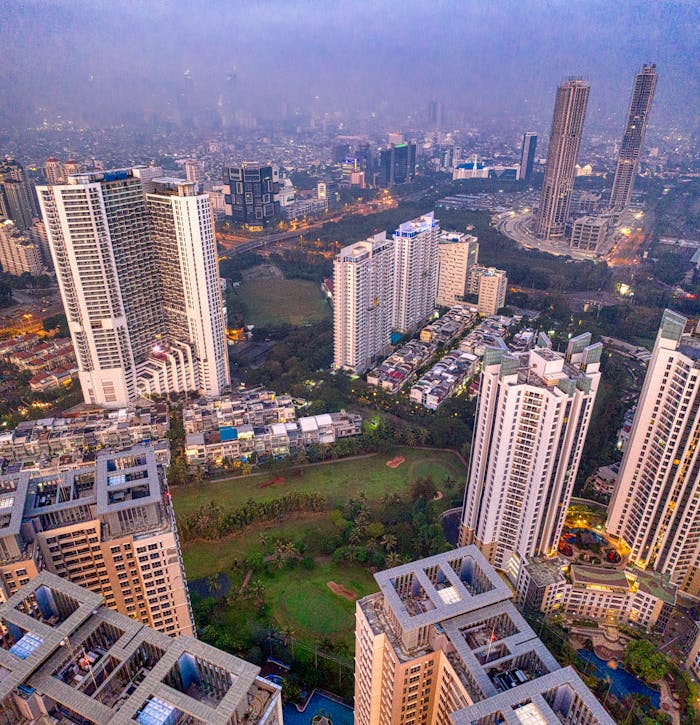 Stunning aerial shot of Jakarta's skyline featuring modern skyscrapers and cityscape at dusk.